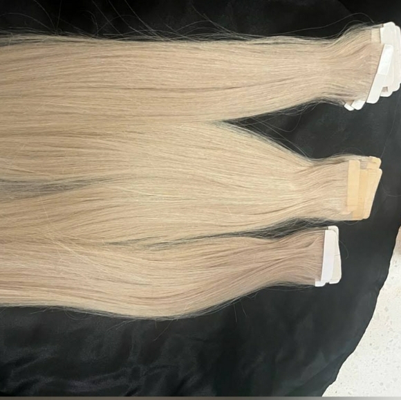 Platinum blonde human hair tapein hair extensions